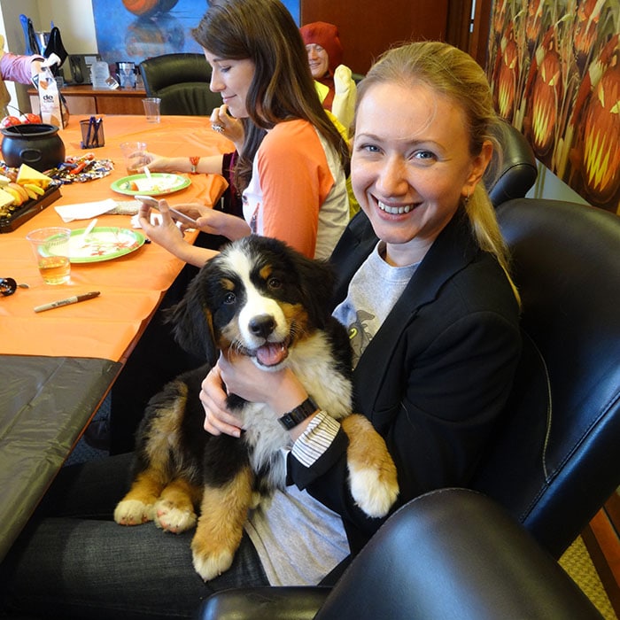 Hercules Capital team member with a puppy.